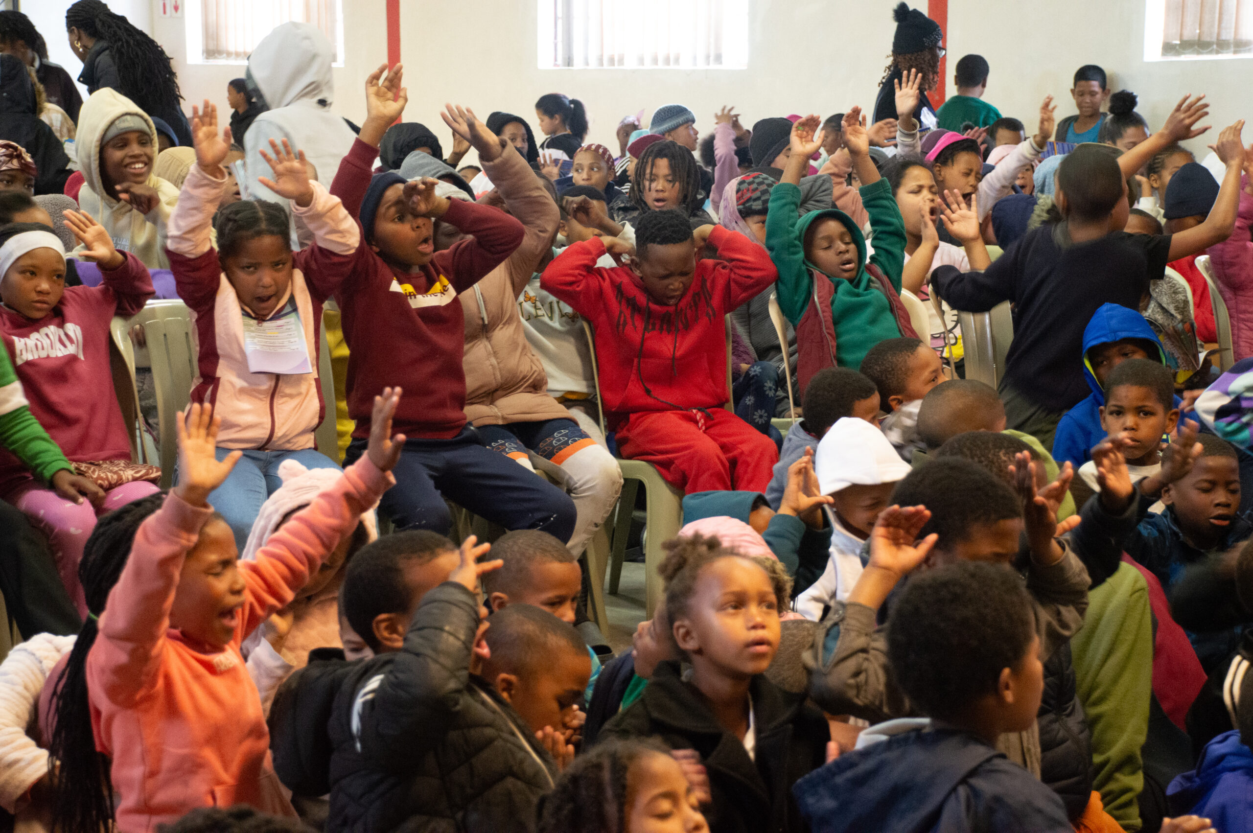 Children gathered during a Say Yes To Kids outreach event.